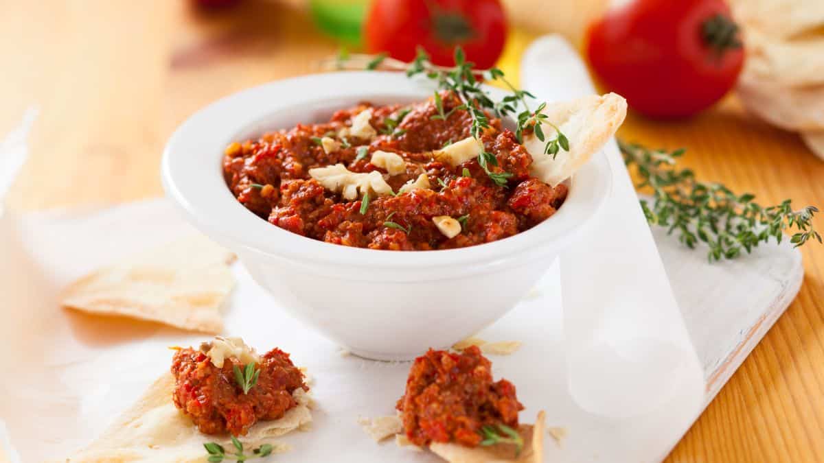 featured image of roasted red pepper dip with walnuts blog post.